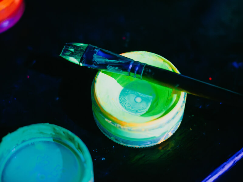 Yellow paint pot and brush capture in fluorescent light